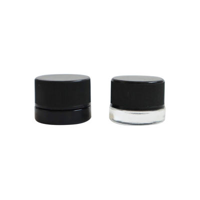O concentrado preto branco claro do  range o frasco de vidro resistente da cera da criança